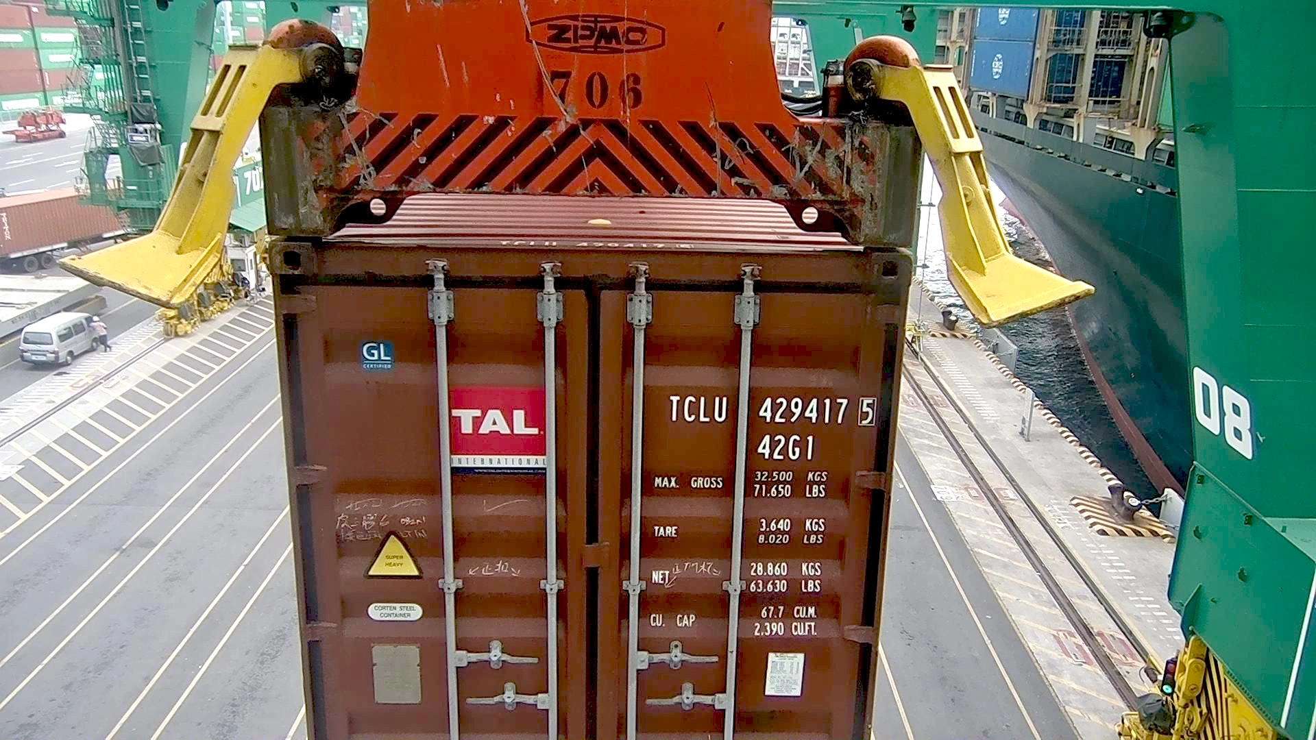 Operator managing container exceptions via CERTUS STS Crane OCR system from a central desk for streamlined terminal operations.