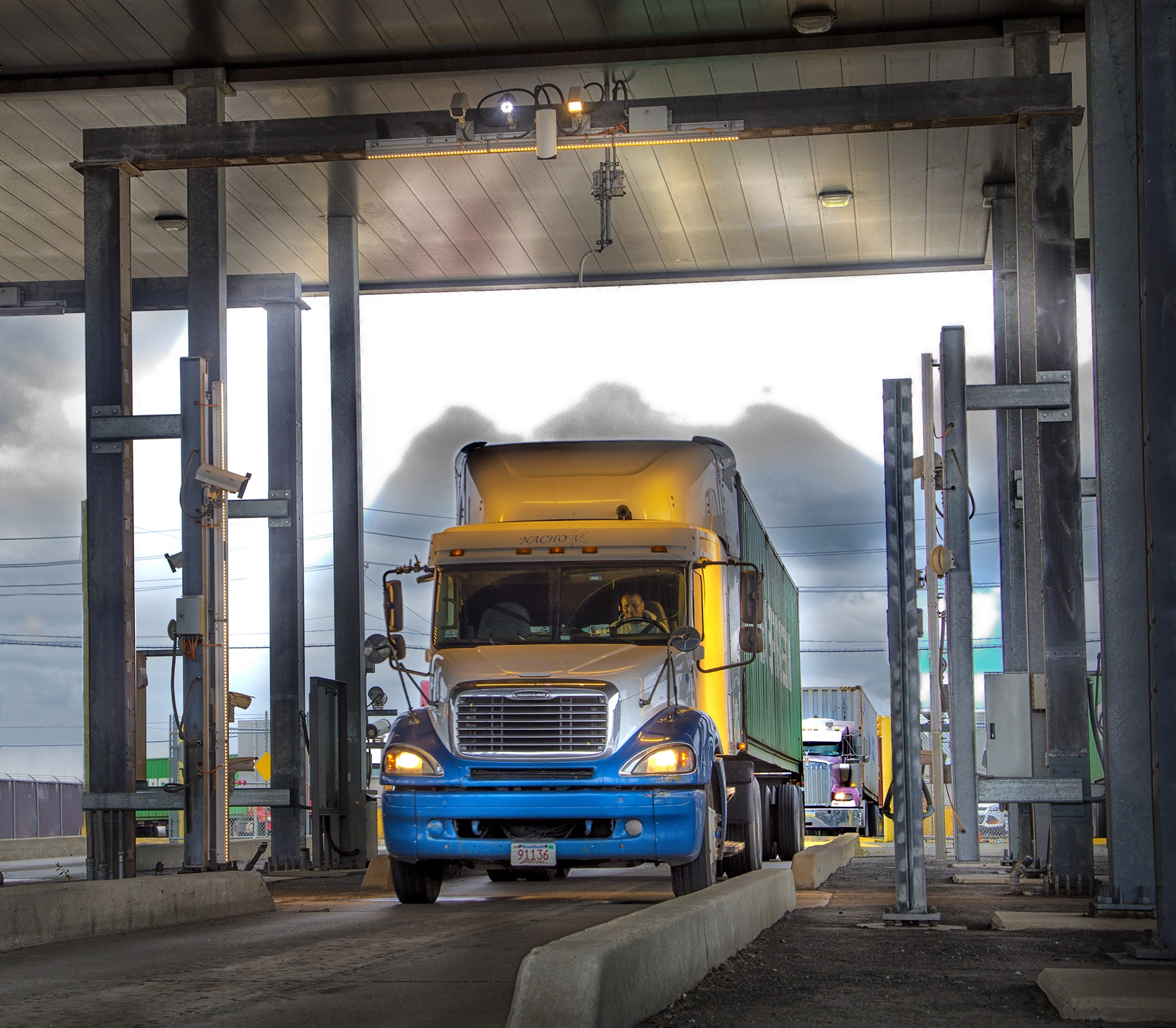 Truck passing through AutoGate OCR portal for automated license plate recognition {{brizy_dc_image_alt imageSrc=