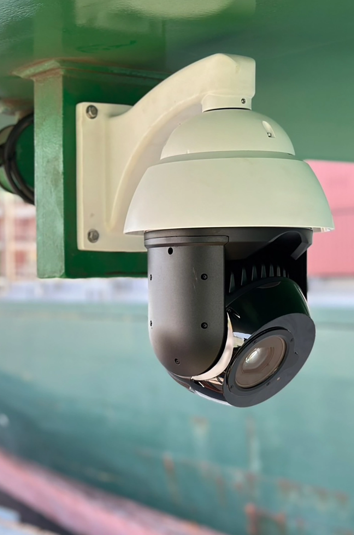 Crane-Mounted OCR Camera for Container Identification at Kaohsiung Port KC7 Close-up view of an OCR camera mounted on a ship-to-shore crane at Kaohsiung Port KC7 for automated container recognition