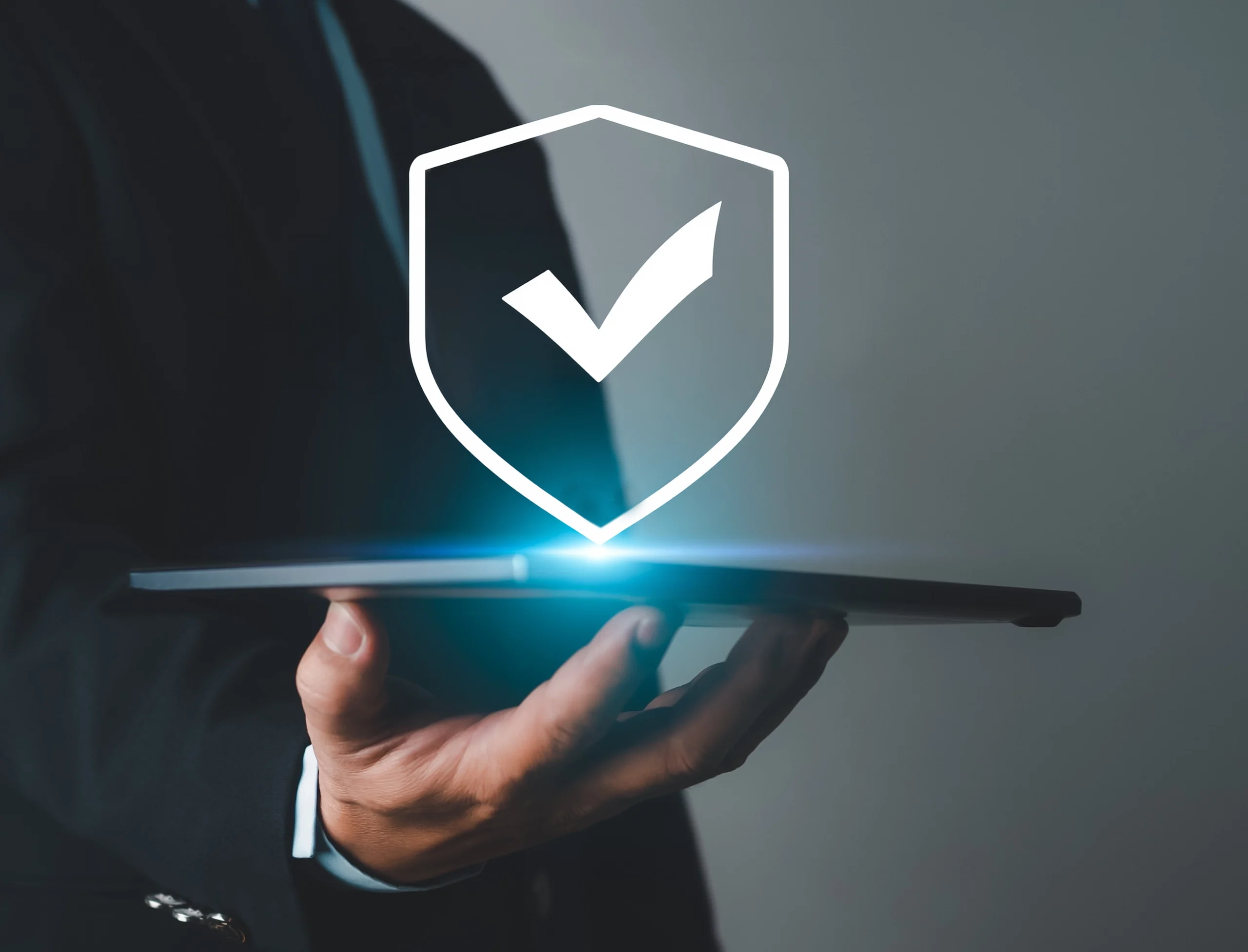 Computer displaying ISO 27002 icon representing cybersecurity compliance in logistics